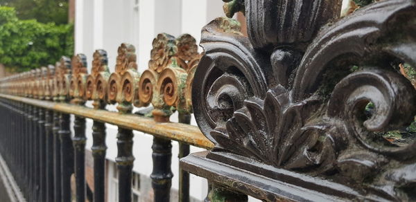 Close-up of metal fence against blurred background