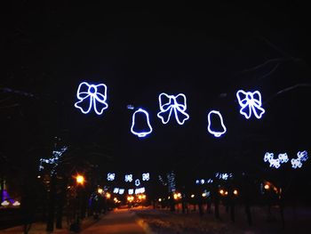 Illuminated road sign at night