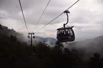 Overhead cable car against sky