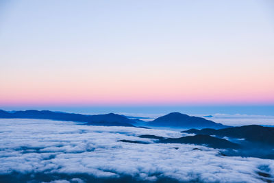 Scenic view of snow mountains against sky during sunset