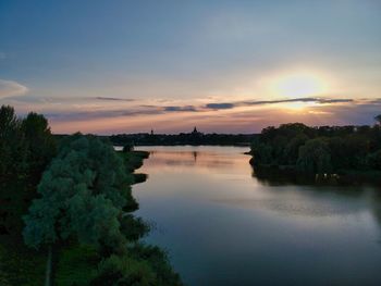 Scenic view of lake against sky during sunset