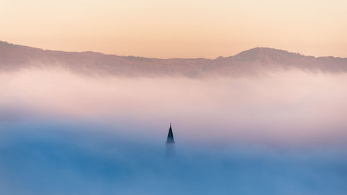 Silhouette mountain against sky during sunset