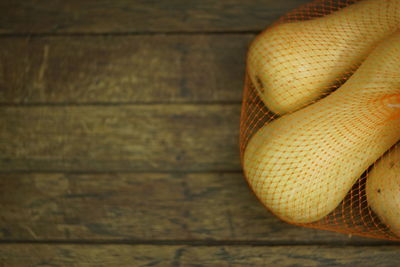 Close-up of snake on hardwood floor