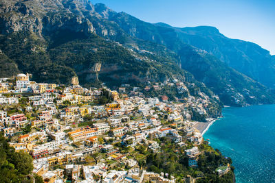 High angle view of townscape by sea