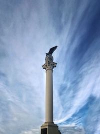 Low angle view of statue against sky