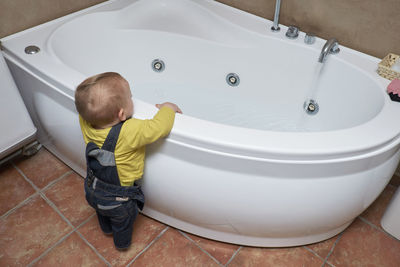 High angle view of boy in bathroom at home