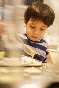 Cute boy looking at ice cream