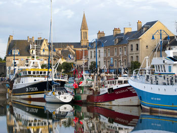 Boats moored at harbor