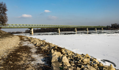 Scenic view of beach against sky during winter