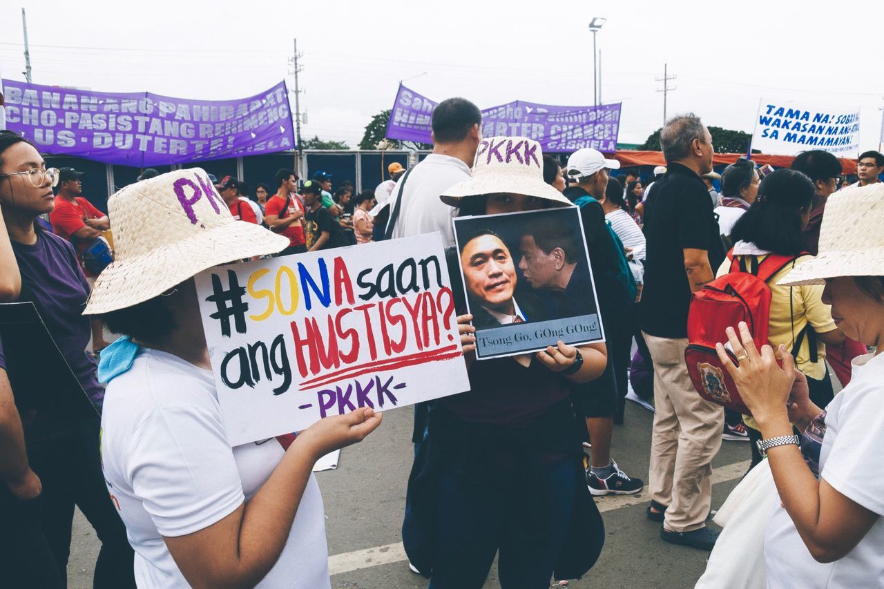 group of people, real people, crowd, text, large group of people, western script, men, women, protest, communication, adult, day, casual clothing, lifestyles, celebration, protestor, event, outdoors, city, message, democracy