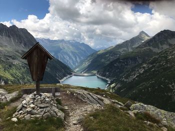 Scenic view of lake and mountains against sky