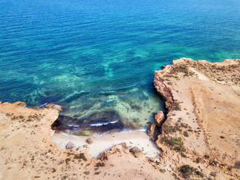 Blue water bay between rocks, oman taken in 2015