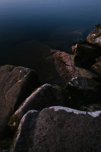 High angle view of rocks at sea shore