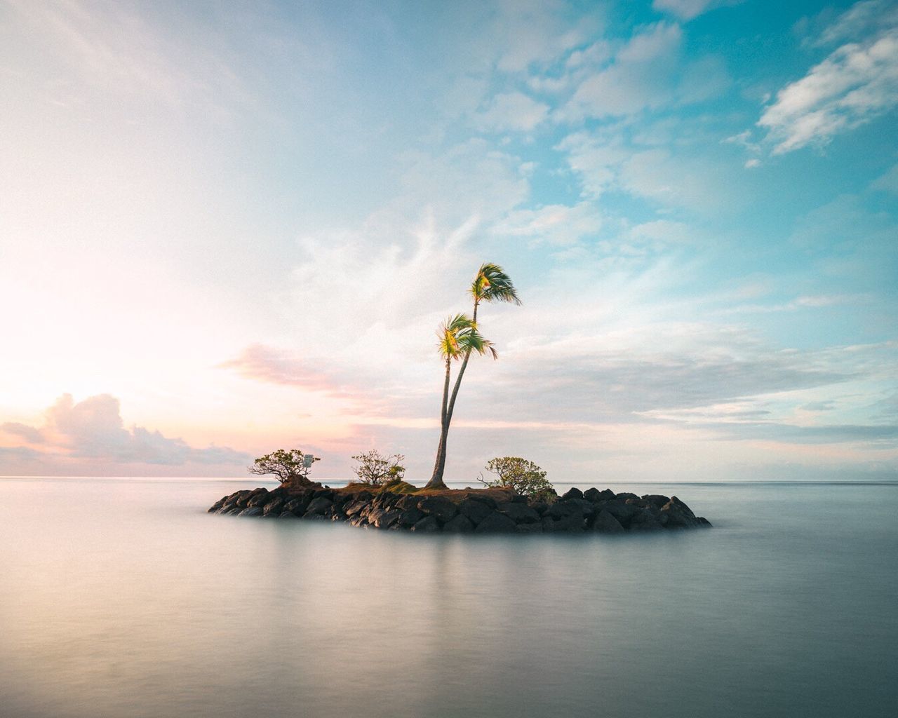 UMBRELLA BY SEA AGAINST SKY