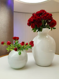 Close-up of roses in vase on table