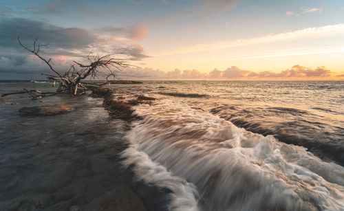 Scenic view of sea against sky during sunset