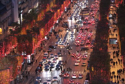 High angle view of traffic on city street amidst buildings