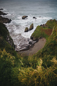 High angle view of rocks by sea