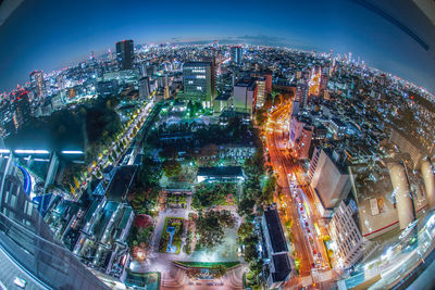 High angle view of illuminated buildings in city at night