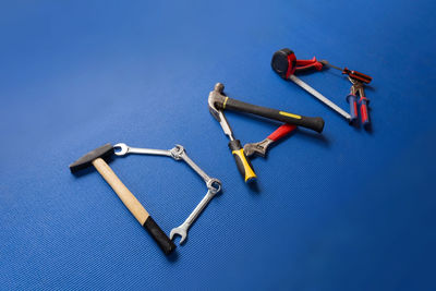 High angle view of shopping cart against blue background