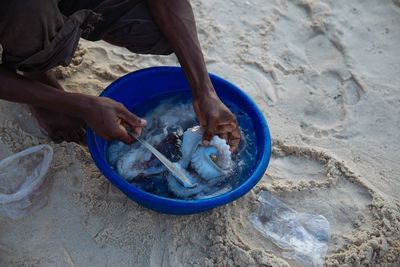 High angle view of man preparing food at beach