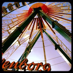 Low angle view of ferris wheel against sky