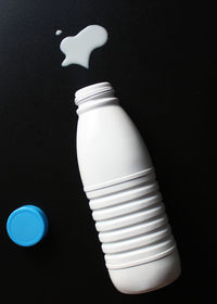 Close-up of light bulb against black background