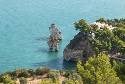 High angle view of rocks in sea