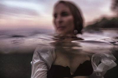 Woman swimming in sea