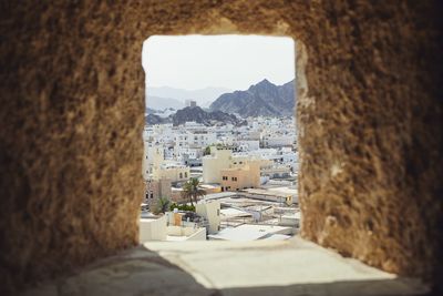 Buildings in town seen through window