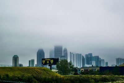 Buildings in city against sky