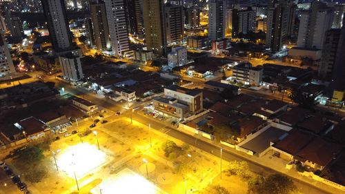 High angle view of illuminated cityscape at night