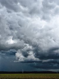 Storm clouds over field