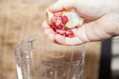 Close-up of hand holding ice cream