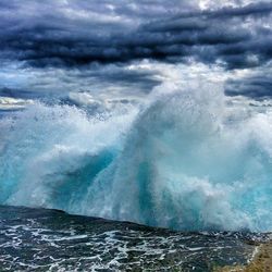 Scenic view of sea against cloudy sky