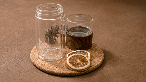 Empty infused water with dried herbal orange slices.