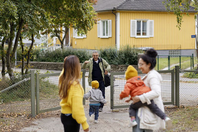 Family meeting each other outside