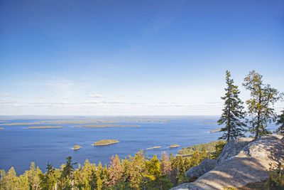 Scenic view of sea against blue sky