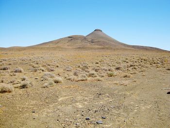 Scenic view of desert against clear sky