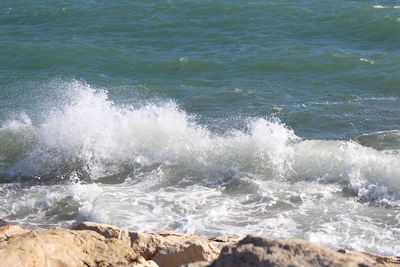 Waves splashing on rocks