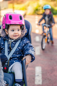Portrait of cute girl riding bicycle