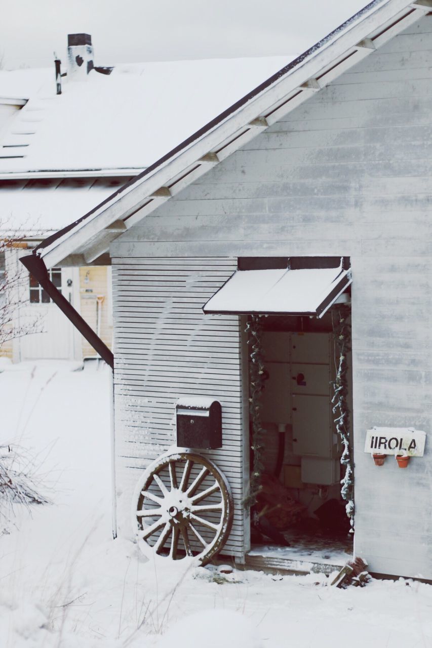 architecture, built structure, building exterior, house, transportation, day, wall - building feature, abandoned, cable, outdoors, power line, electricity, no people, residential structure, brick wall, mode of transport, wall, old, sky, snow