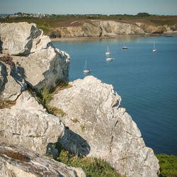 High angle view of lake by rock formation