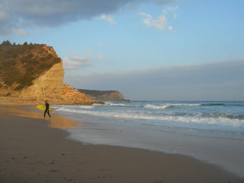 Scenic view of beach against sky