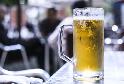 Close-up of beer glass on table