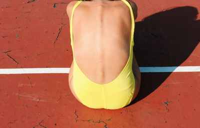 High angle view of woman standing on umbrella