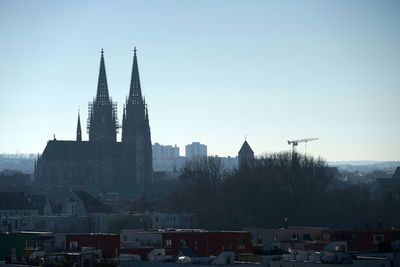 View of regensburg buildings in city against clear sky