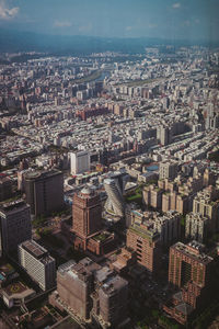 High angle view of buildings in city against sky