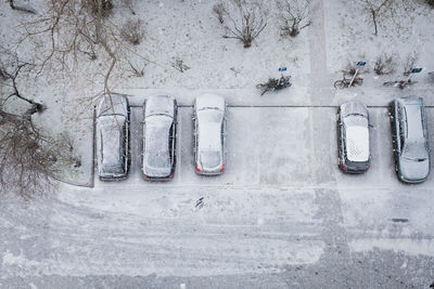 High angle view of frozen cars on road