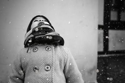 Girl looking up during winter